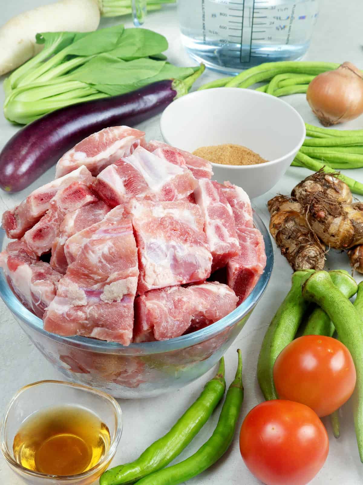 pork spare ribs, egg plant, radish, gabi, tomatoes, chili pepper, fish sauce, tamarind powder, pechay, sitaw
