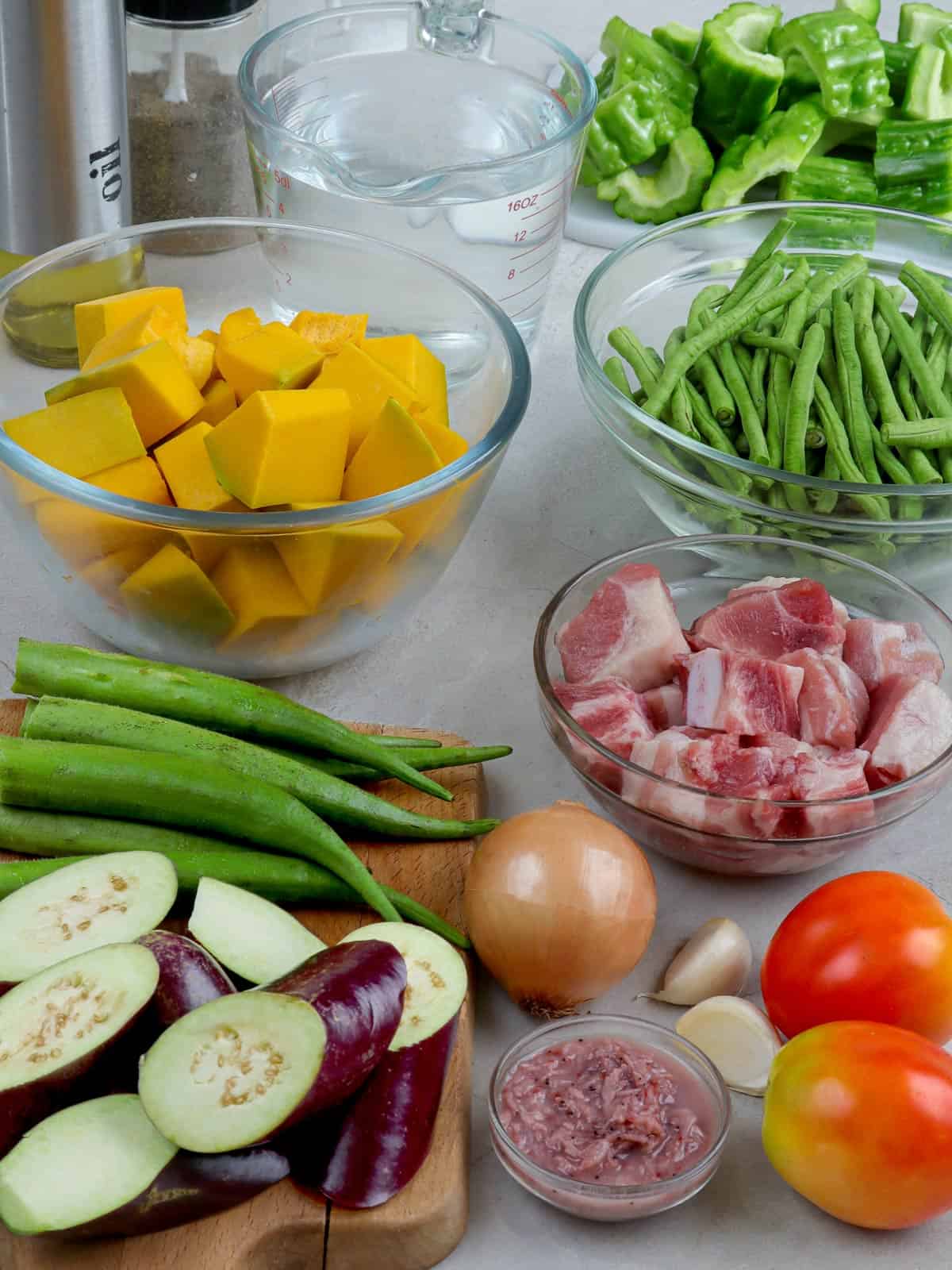 eggplant, okra, pork belly, kalabasa, sitaw, tomatoes, onion, garlic