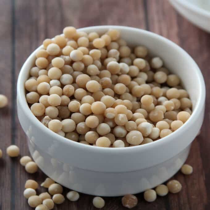dry sago pearls in a white bowl