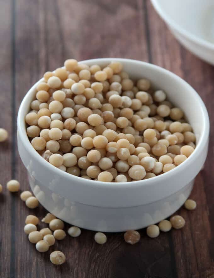 dry sago pearls in a white bowl