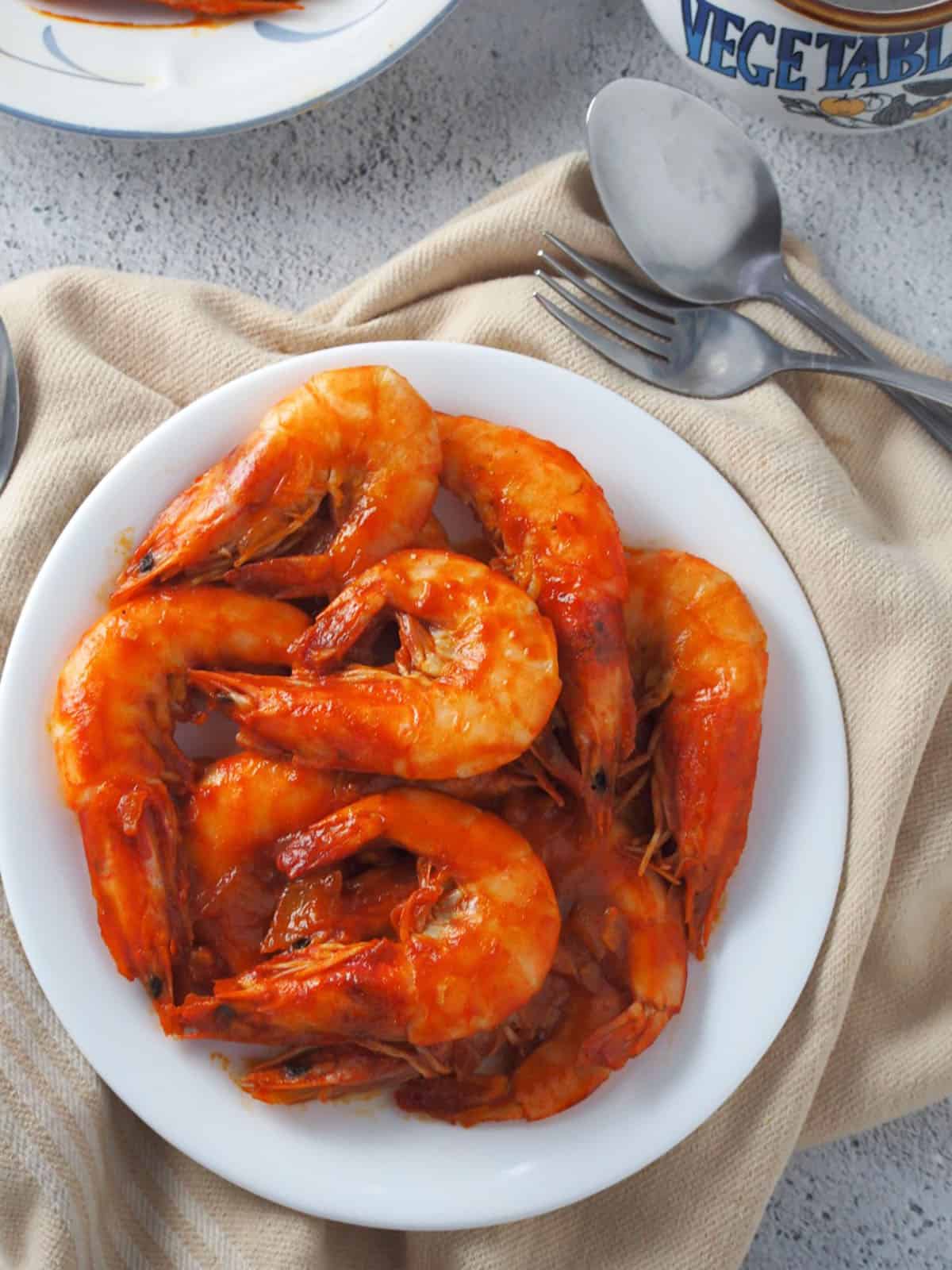 shrimp with sweet and savory sauce on a white plate