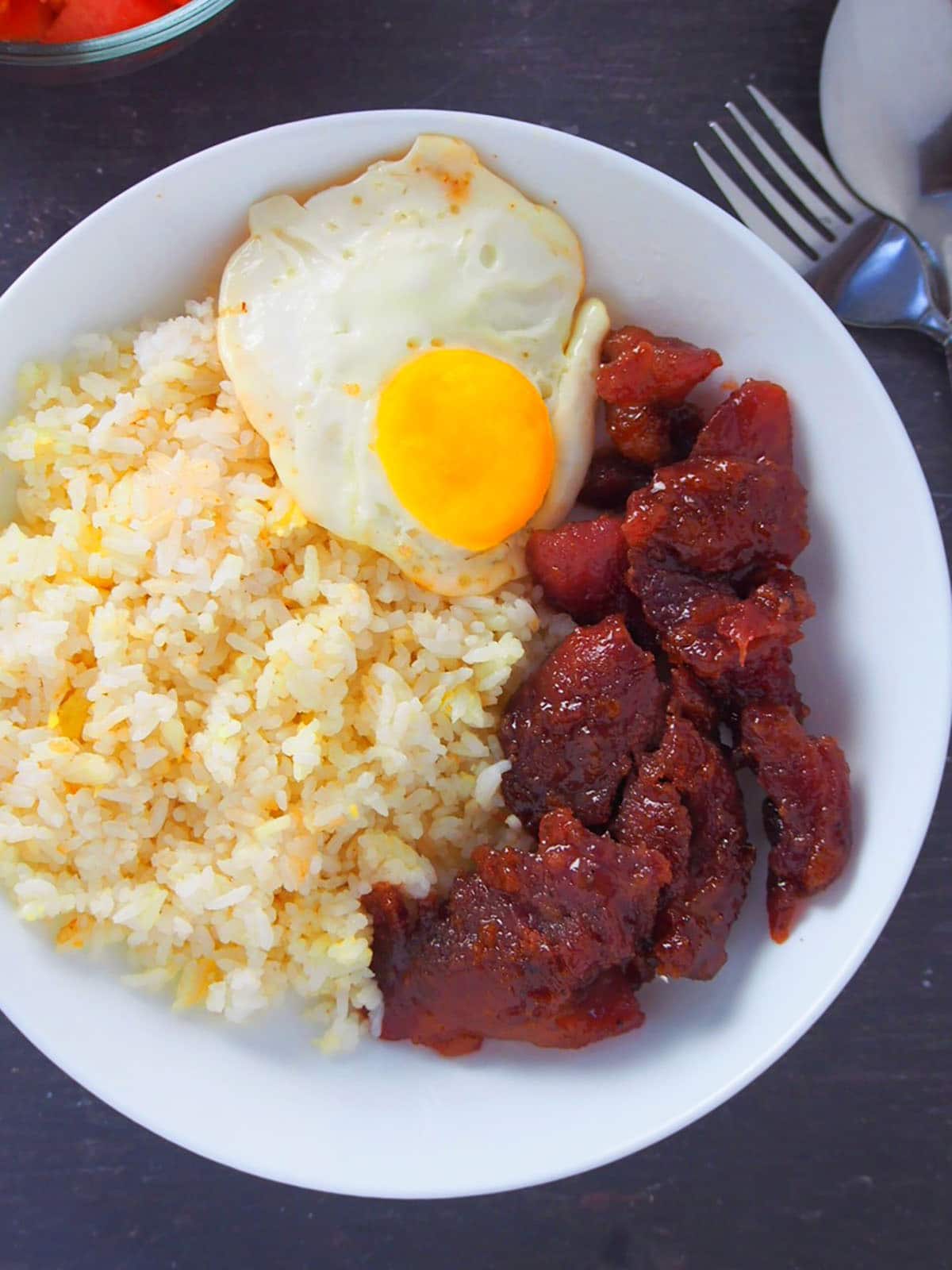 top view of pork tocilog on a white plate