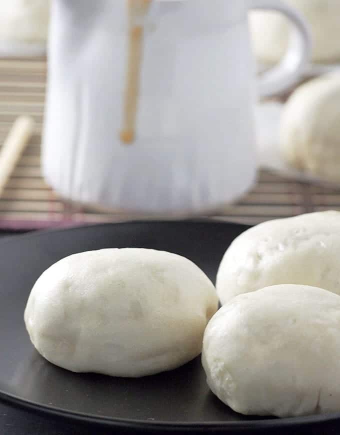 Serve finished steamed meat buns with dipping sauce on the side. 