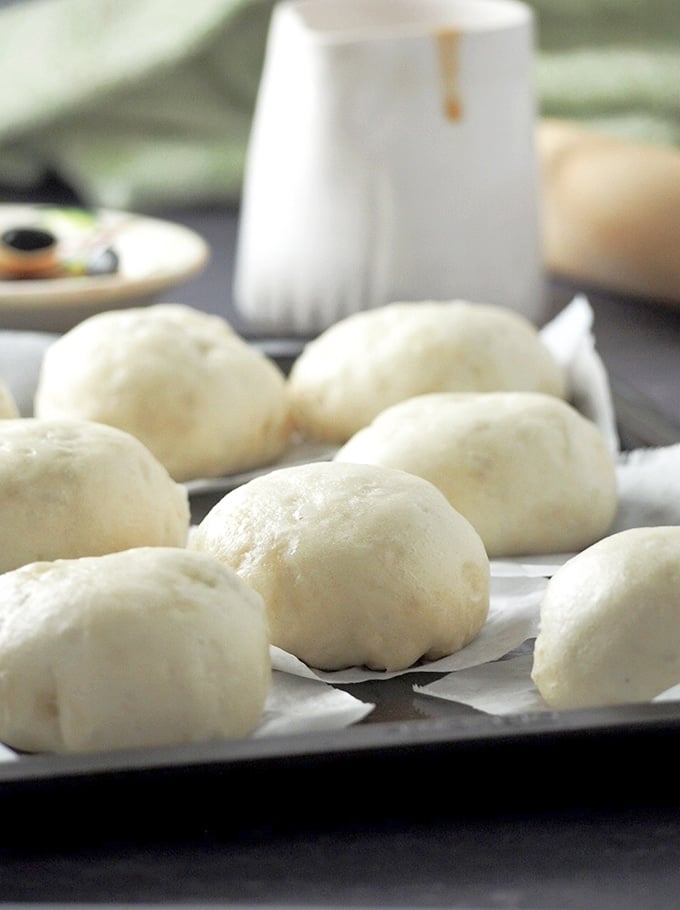 These steamed buns are light, fluffy and served alongside a tasty sauce. 