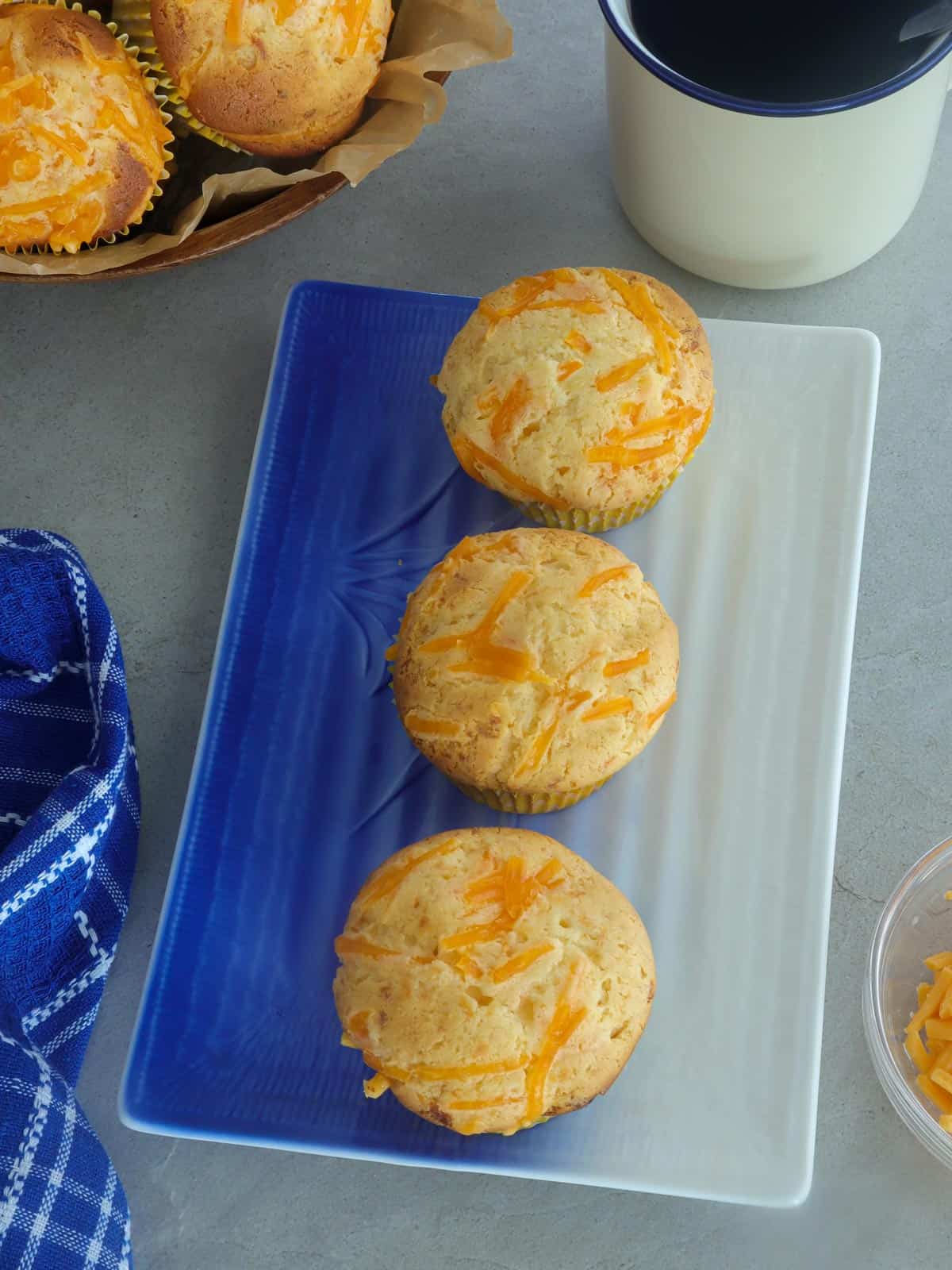 cheese cupcakes on a white platter.