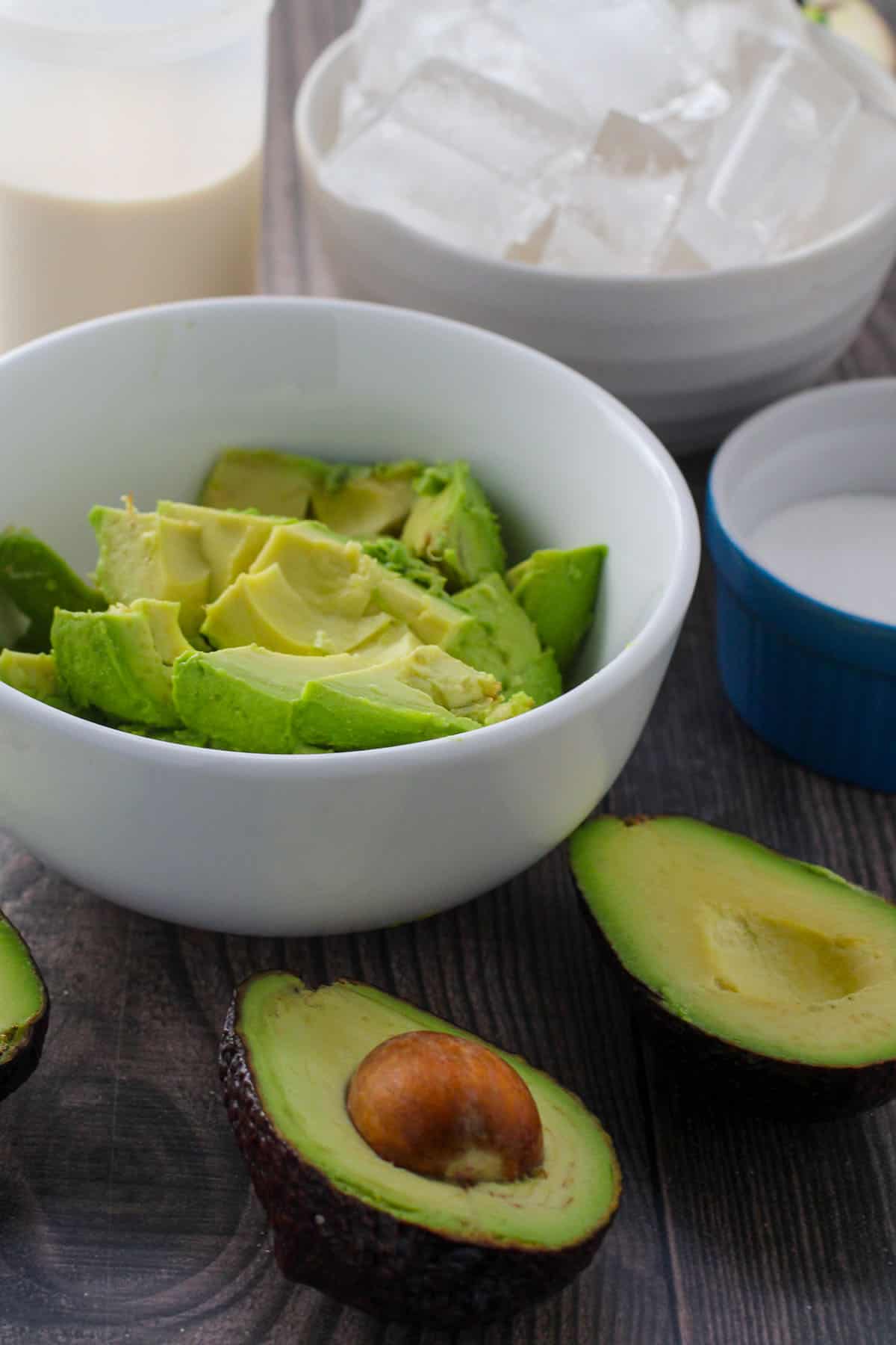 halved avocados, sugar, evaporated milk, ice