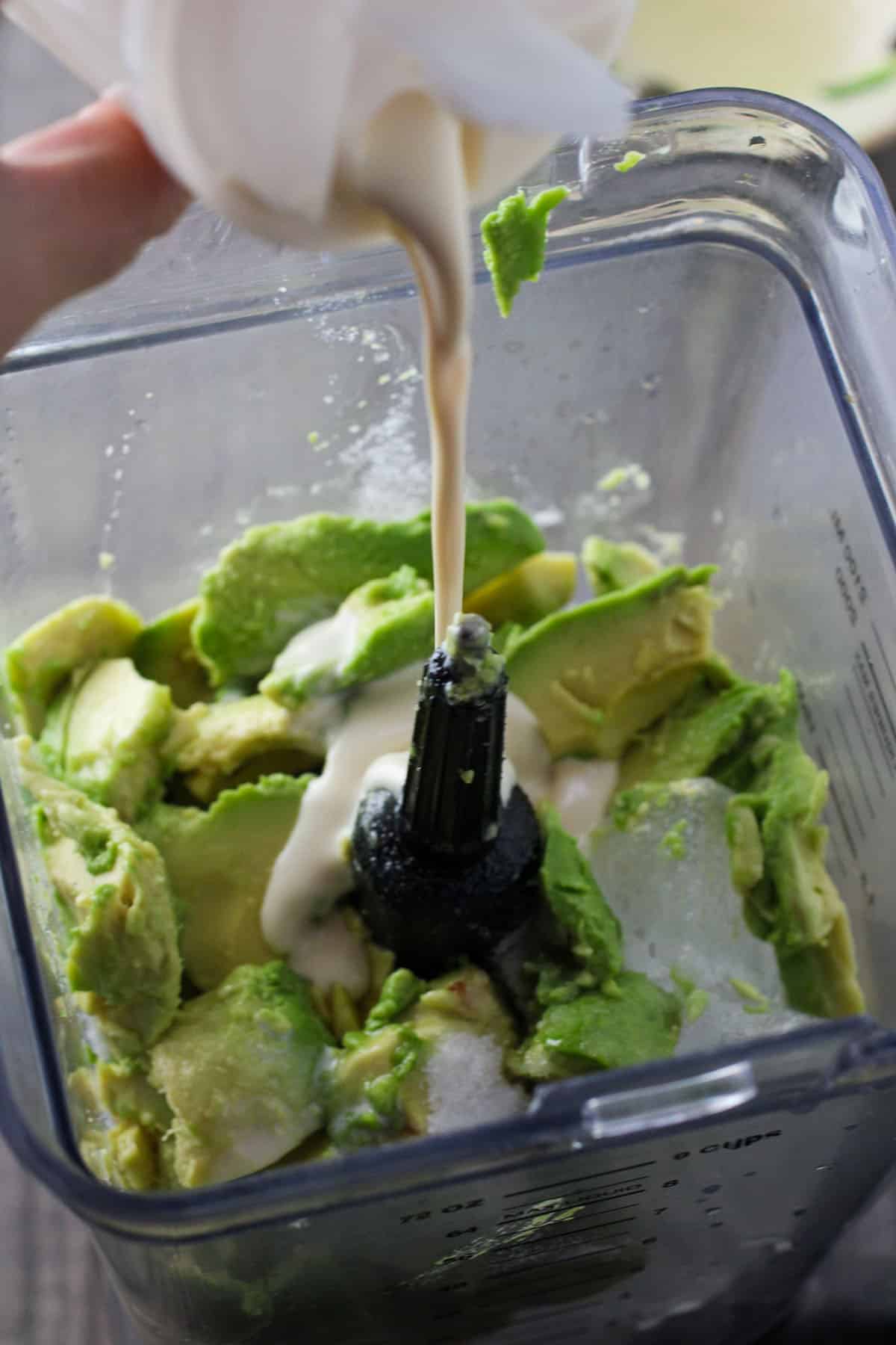 making avocado smoothie in a blender
