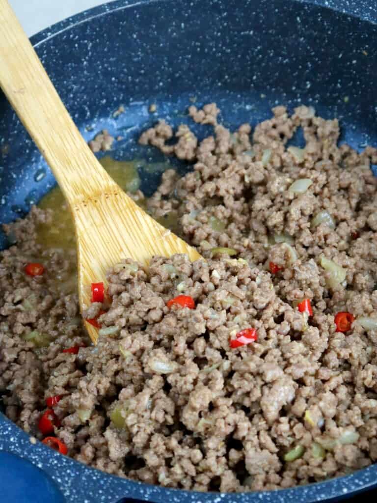 bagis with chili peppers in a pan