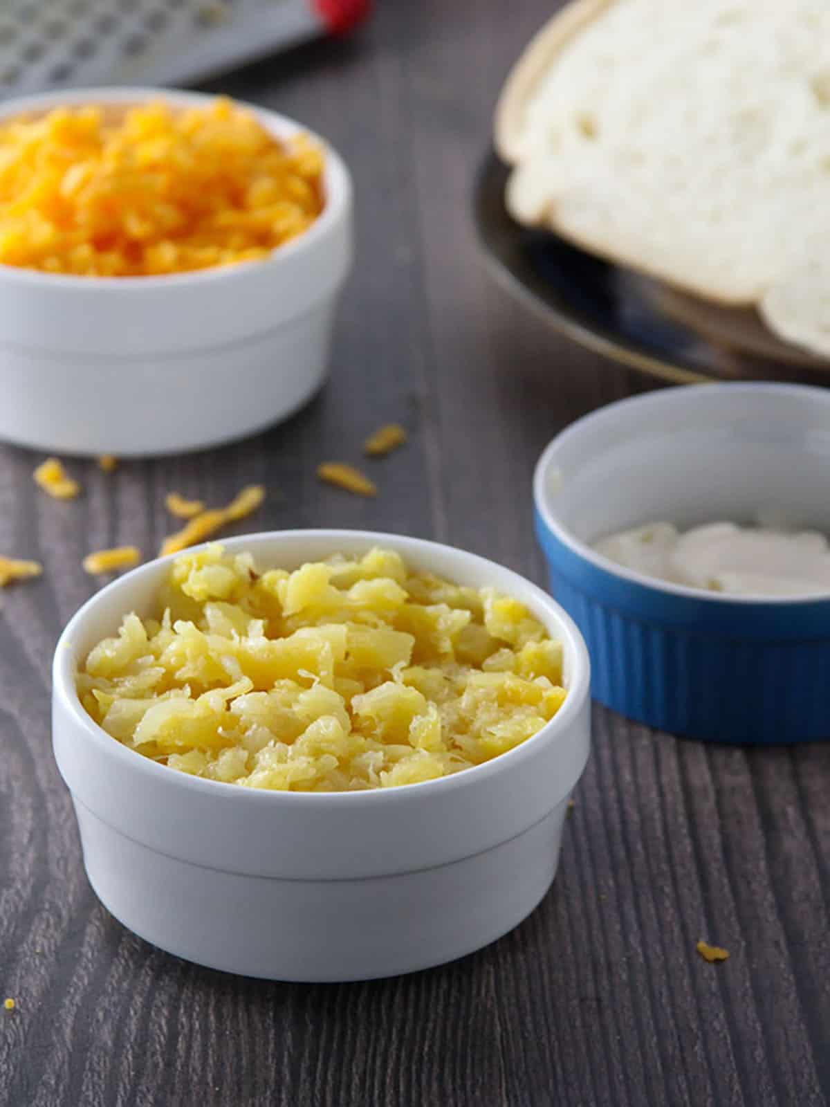 crushed pineapple, mayonnaise, shredded cheese in small bowls