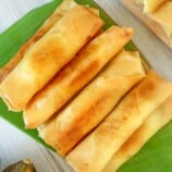 fried lumpiang saging on a banana-lined dish