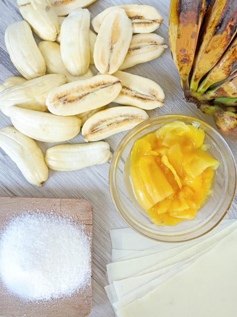 peeled and sliced saba bananas, sweetened jackfruit, sugar, lumpia wrappers