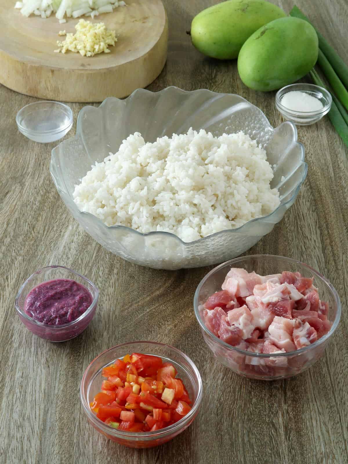 steamed rice, shrimp paste, chopped tomatoes, pork belly, onion, garlic, green mangoes