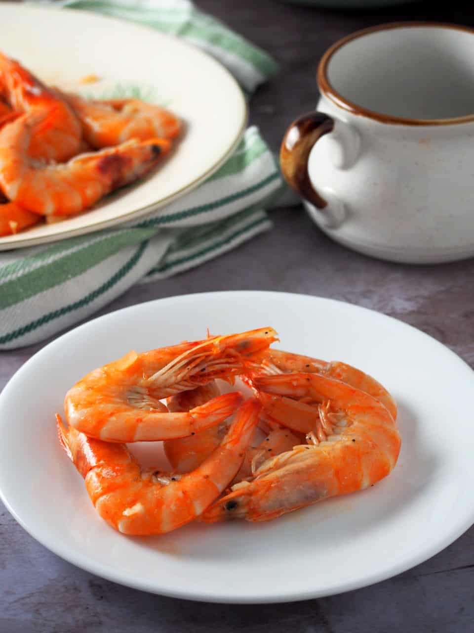 garlic butter shrimp on a white plate