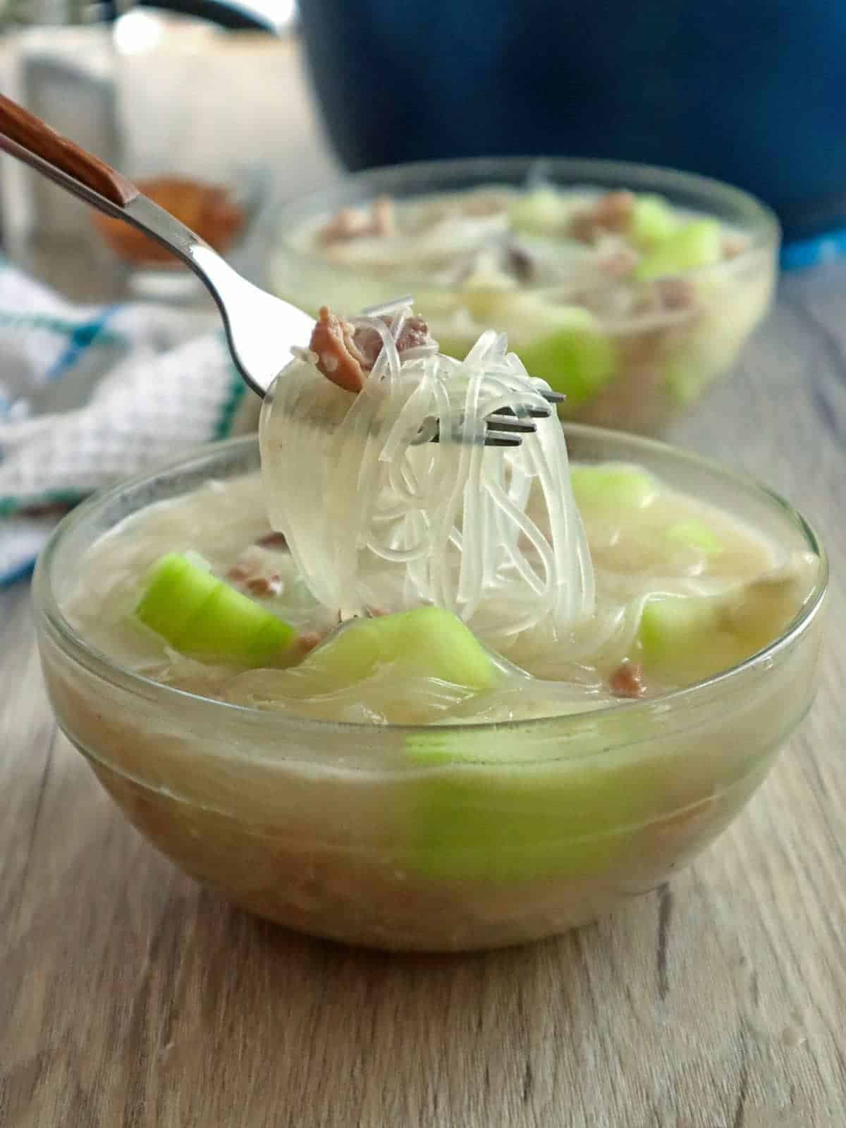 eating sotanghon soup with upo from a bowl