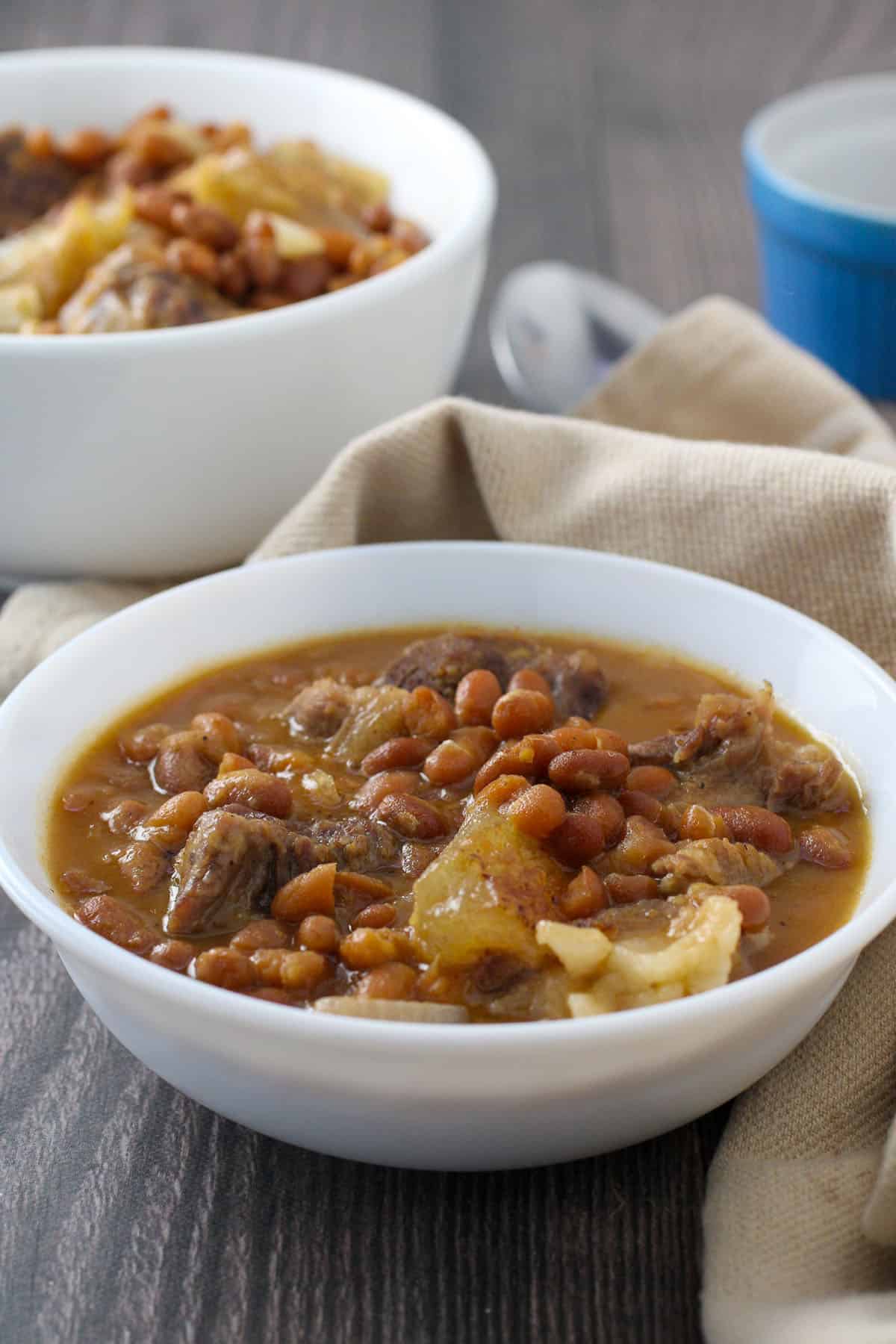 Papis beef tendon and beans stew in a white serving bowl