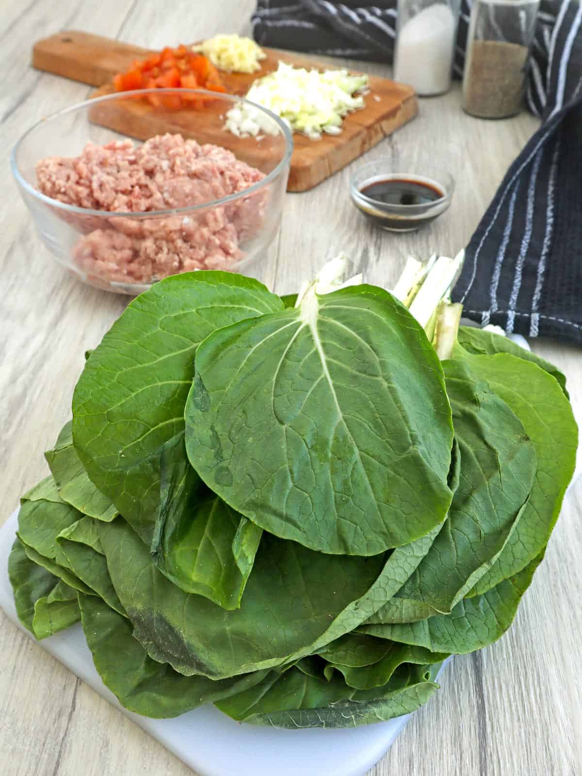 pechay leaves, ground pork, chopped tomatoes, onions, garlic, oyster sauce, salt, and pepper