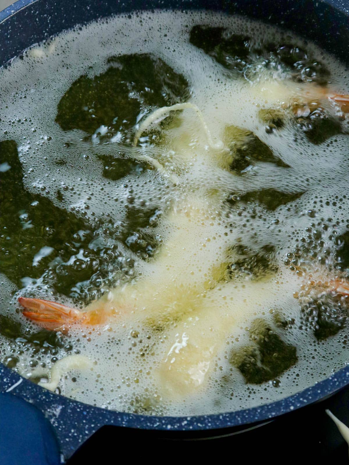 frying camaron rebosado in a pot