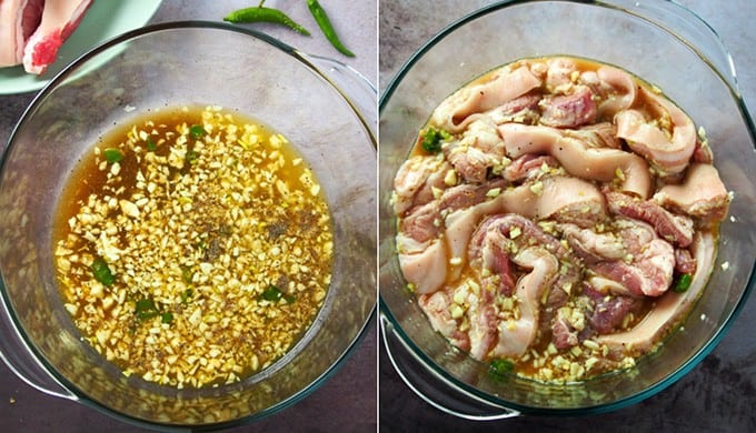 pork belly marinating in calamansi mixture in a large glass bowl