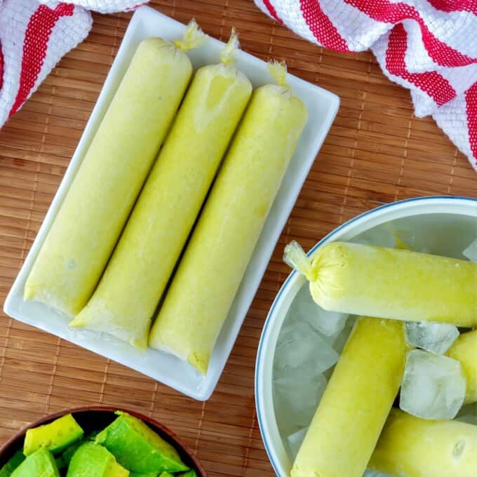 avocado ice candies on a white bowl of ice.