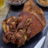 crispy pata on a cutting board.