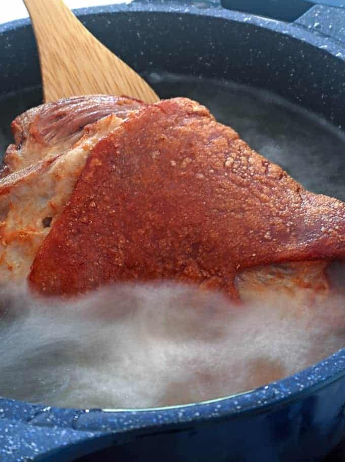 deep-frying pork leg in hot oil