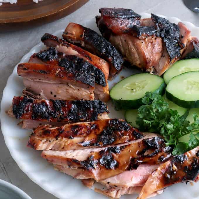 sliced Grilled Tuna Belly on a white plate