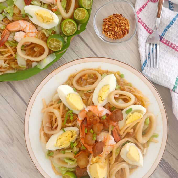 Pancit Malabon on a white serving plate