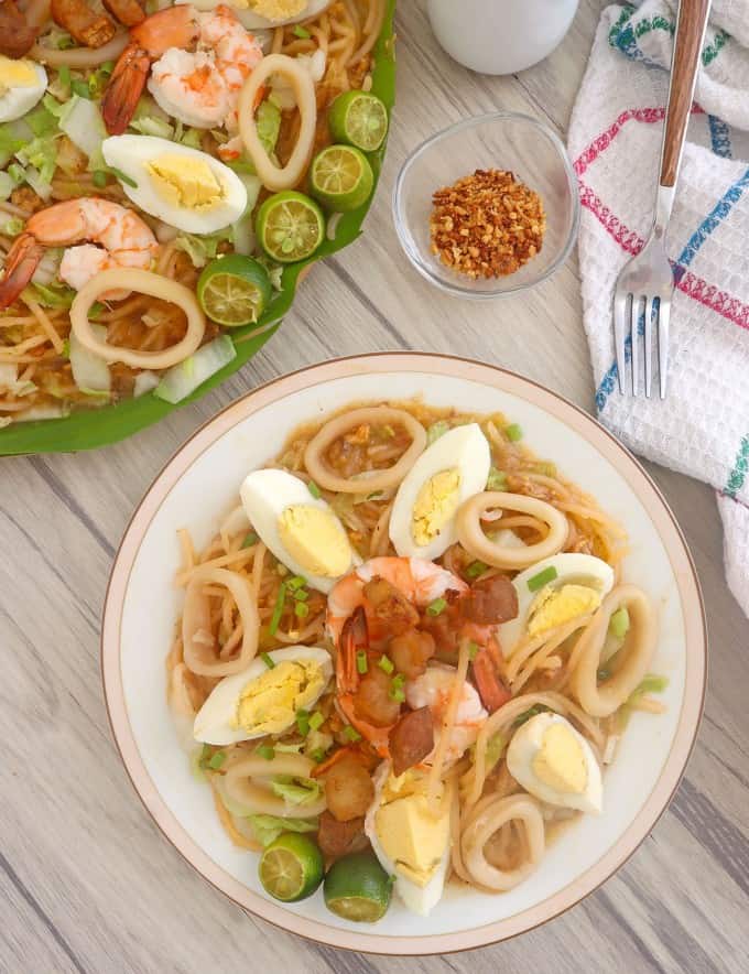 Pancit Malabon on a white serving plate