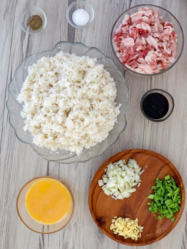 chopped bacon, cold rice, chopped onions, garlic, green onions, soy sauce, beaten eggs, salt, and pepper