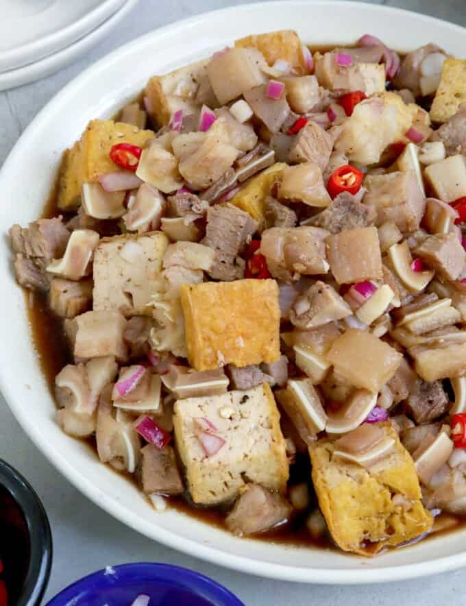 tofu and pork with a spicy vinegar dressing in serving bowl