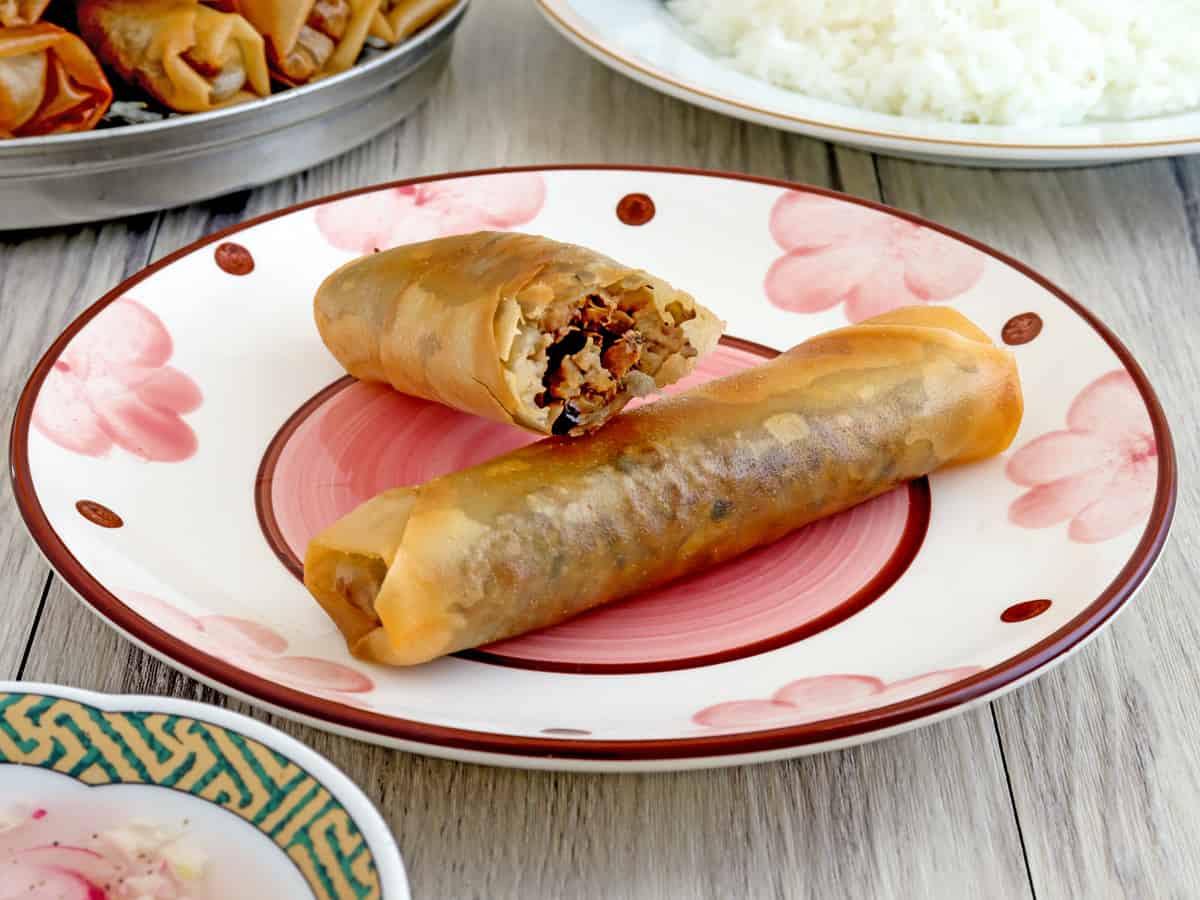 crispy lumpia with puso ng saging filling on a plate