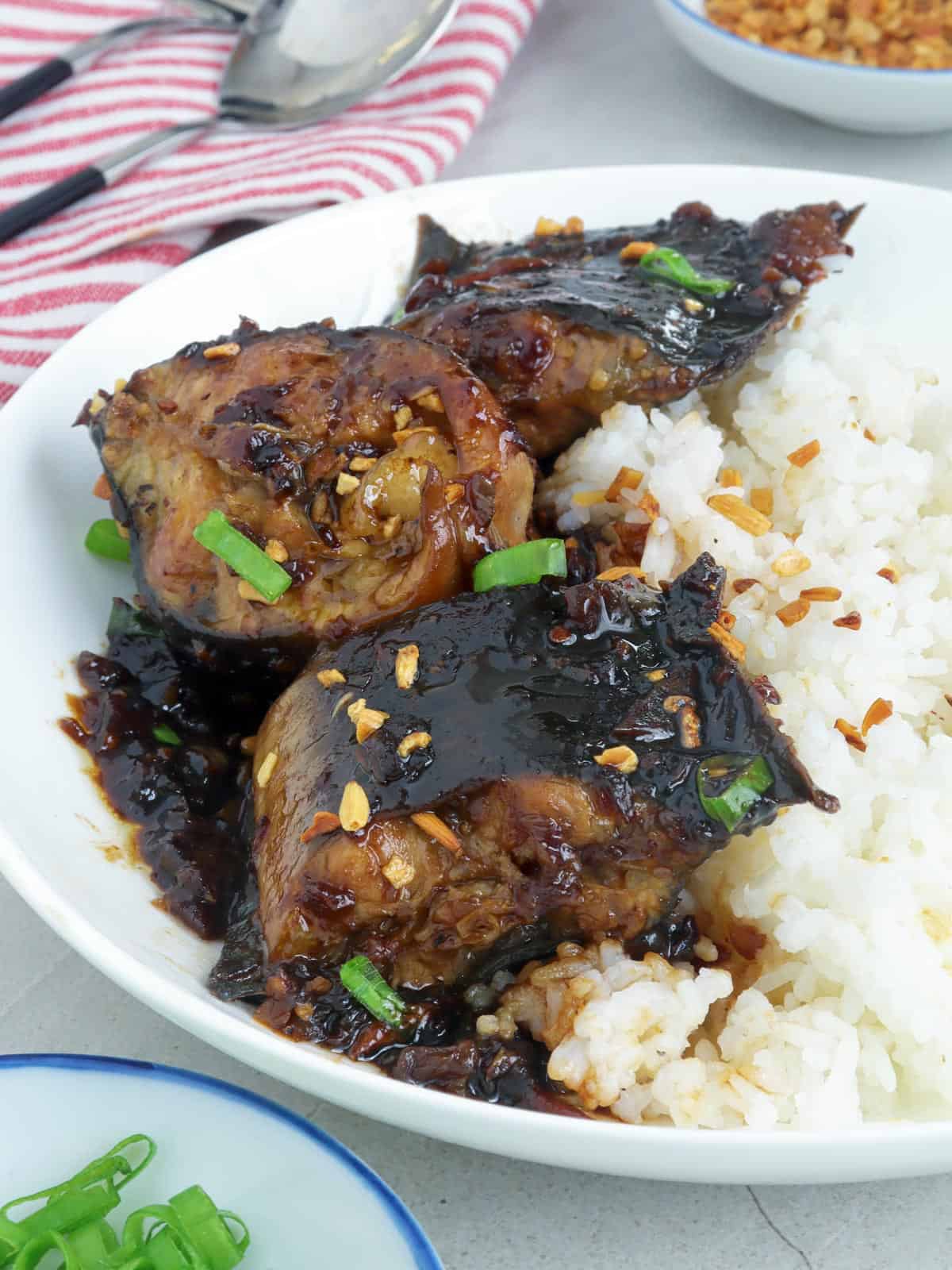 catfish adobo on a serving plate with steamed rice