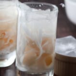 adding ice to glass of Buko Lychee Juice