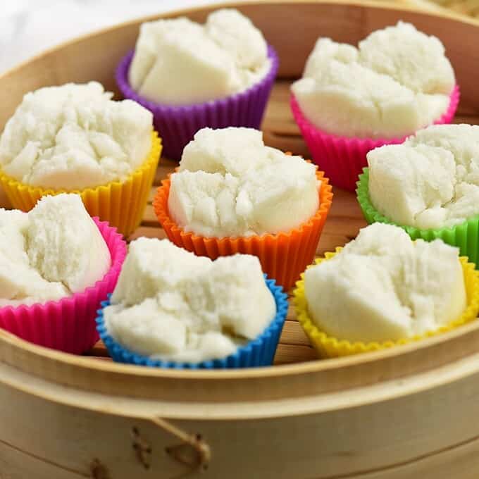 steamed puto on a wooden steamer basket