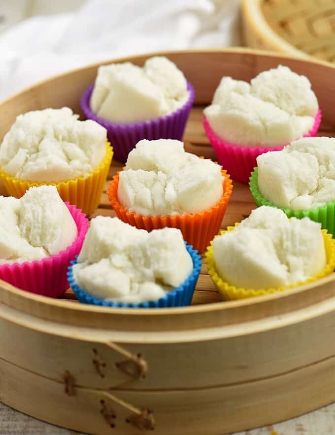 steamed puto on a wooden steamer basket