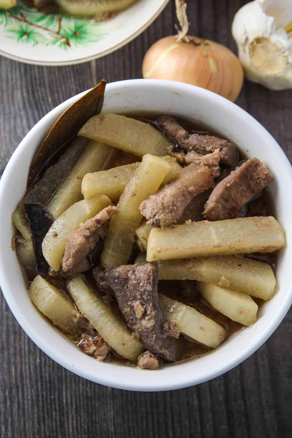 Kilawing Labanos at Baboy in a white serving bowl