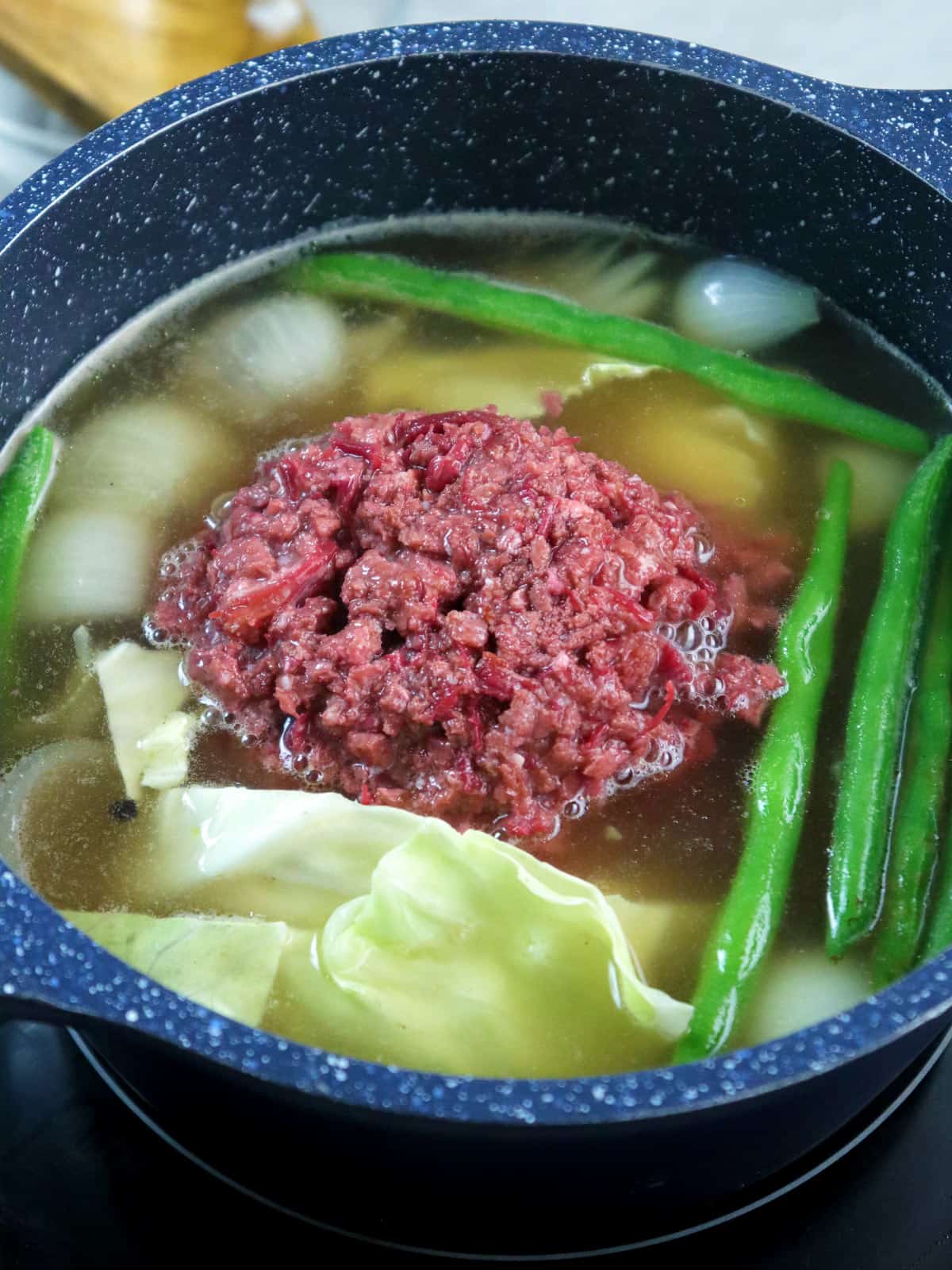 Nilagang Corned Beef in a pot