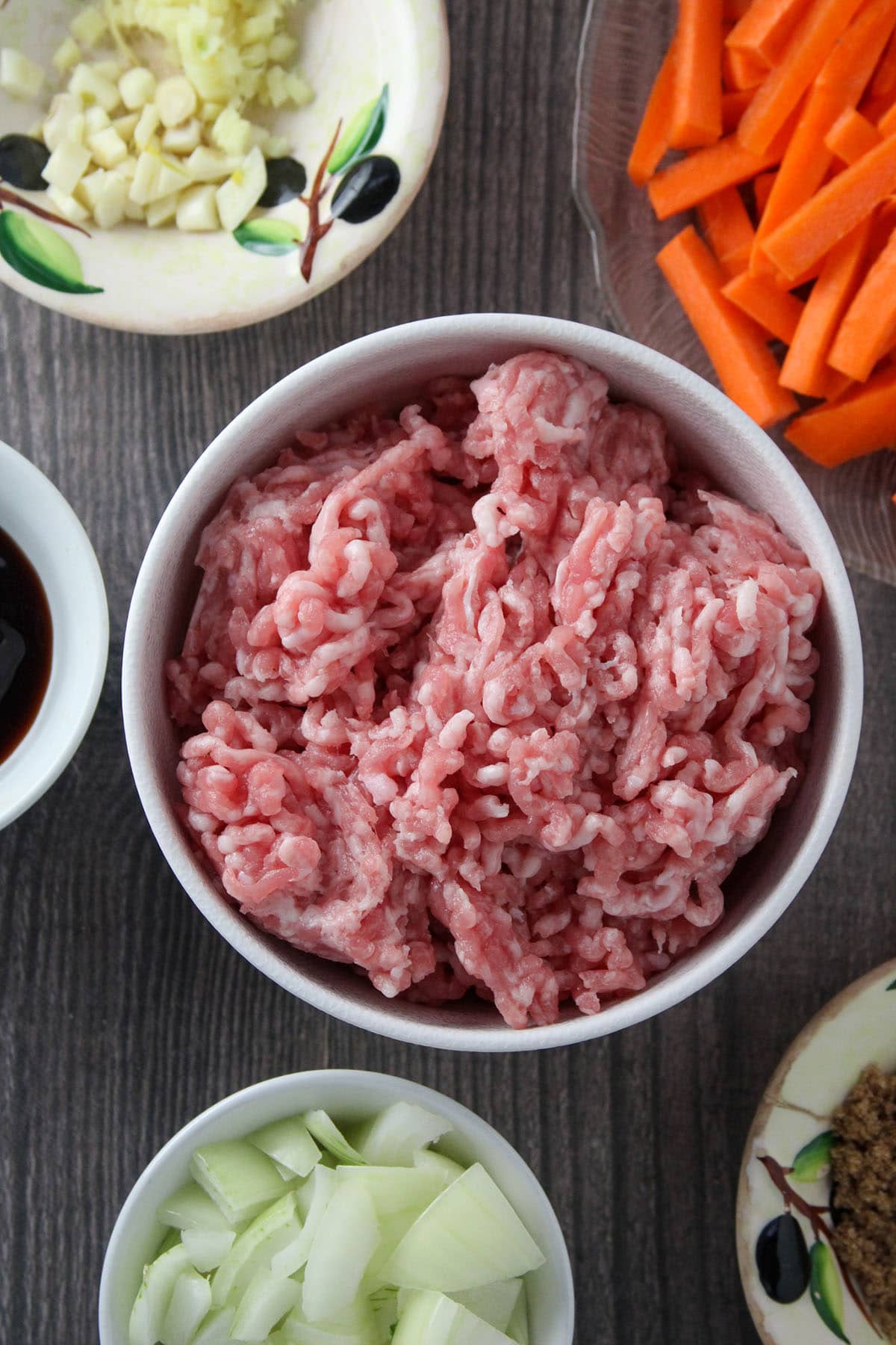 ground pork, julienned carrots, sliced green beans, chopped onions, garlic, soy sauce