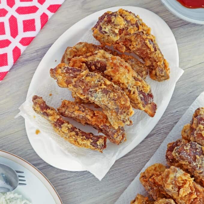 crispy pork ribs on white serving platter