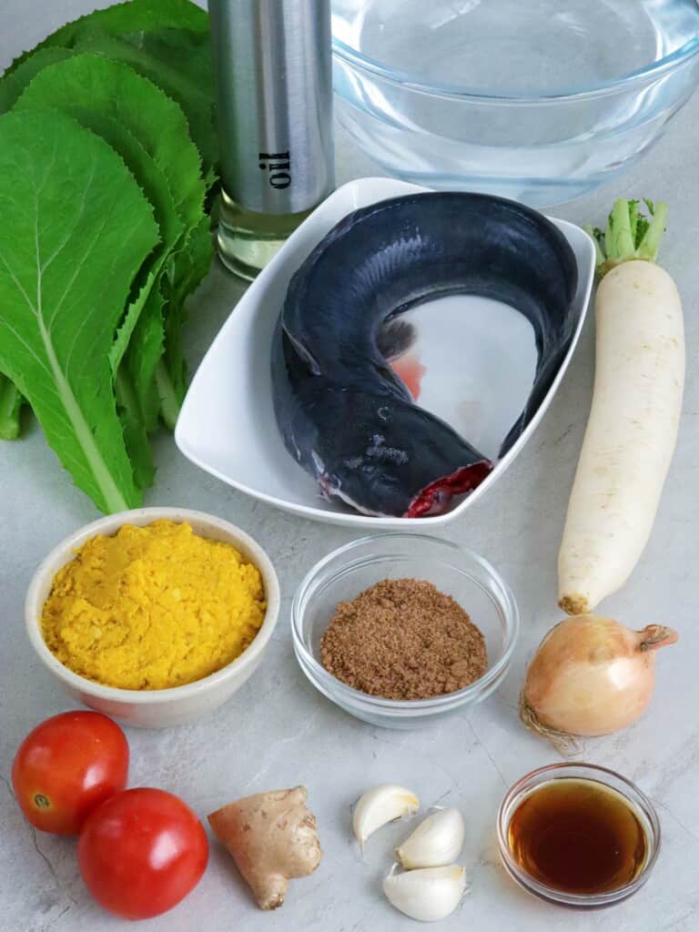 catfish, miso paste, tomatoes, tamarind powder, radish, mustard leaves, fish sauce, onion