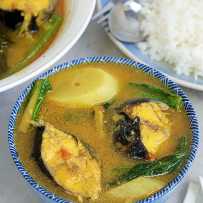 Sinigang na Hito sa Miso in blue bowl with a plate of steamed rice on the side