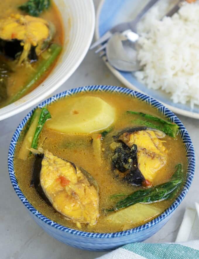 Sinigang na Hito sa Miso in blue bowl with a plate of steamed rice on the side