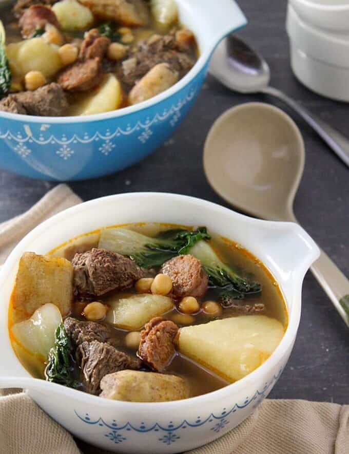 filipino-style beef soup in a bowl
