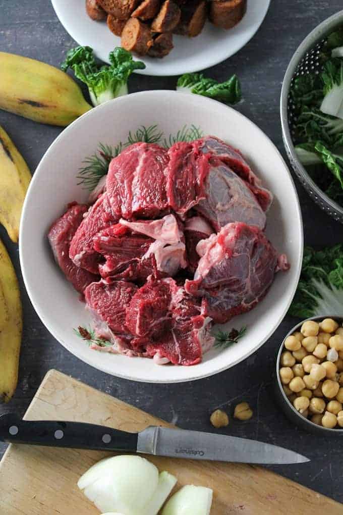 raw boneless beef shanks, smoked sausage, garbanzo beans, saba bananas, pechay, chopped onions