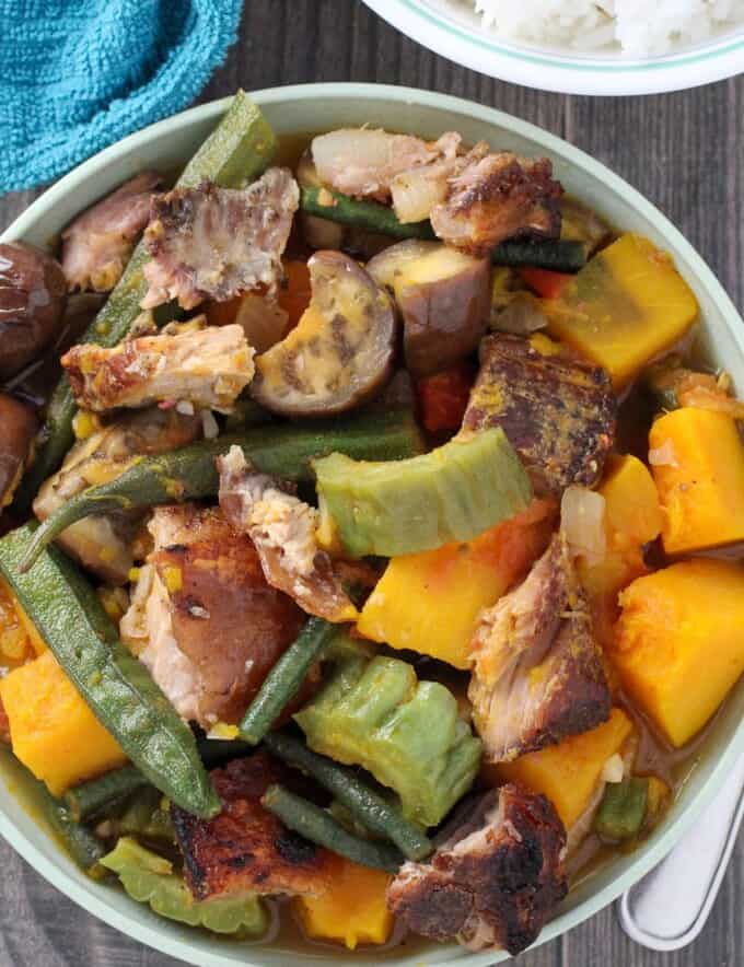 Pinakbet with Crispy Lechon in a white serving bowl