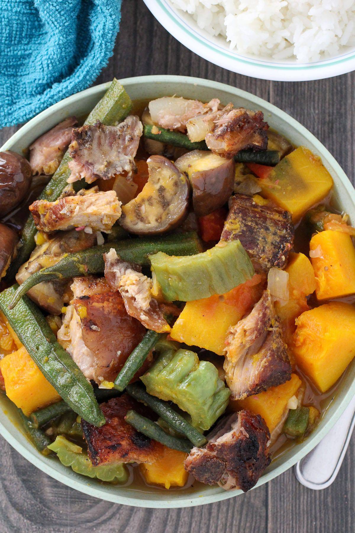 Pinakbet with Crispy Lechon in a white serving bowl