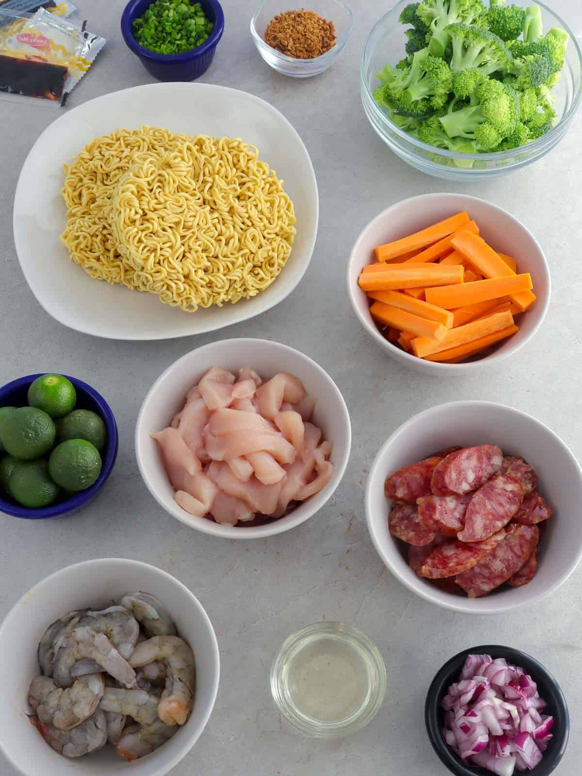 instant ramen, shrimp, chicken, sausage, broccoli, oil, calamansi in bowls