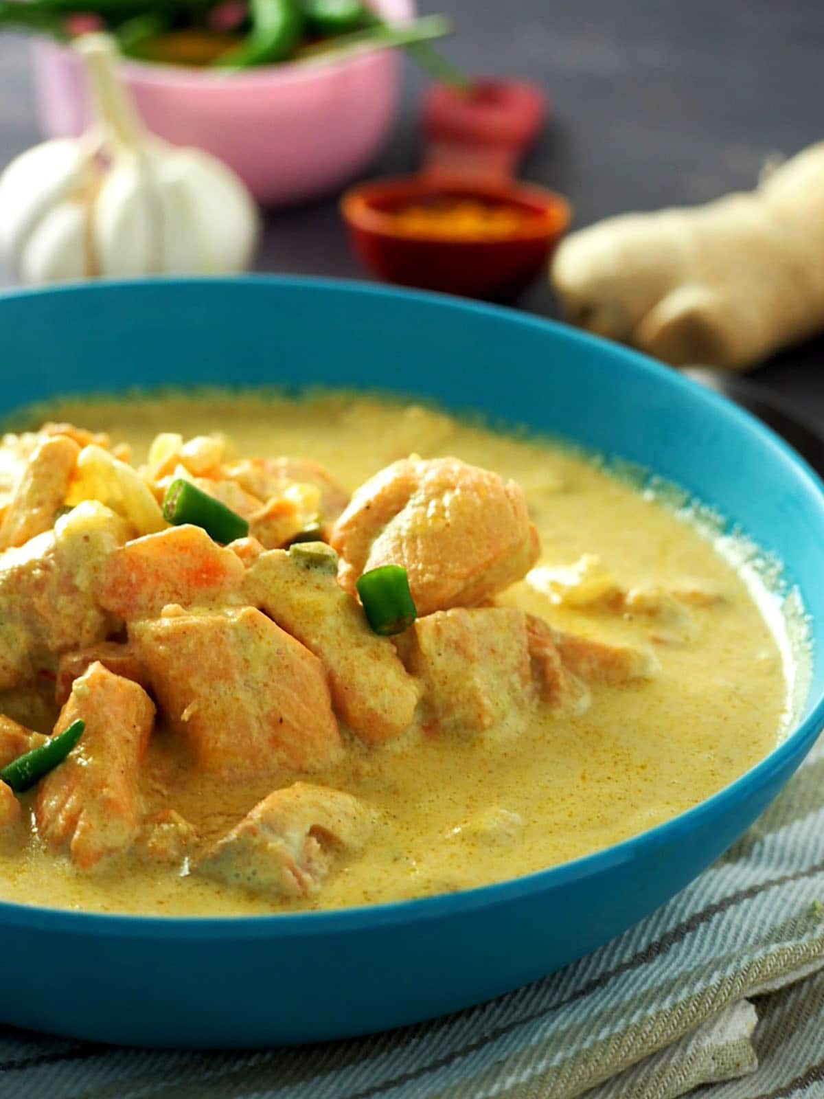 Coconut Curry Salmon in a blue serving bowl