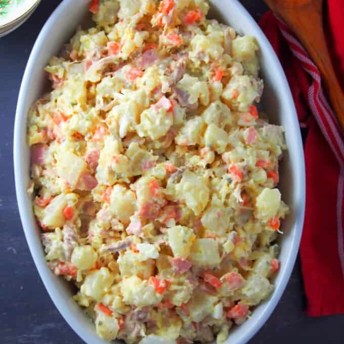 Filipino-style potato salad in a white casserole dish