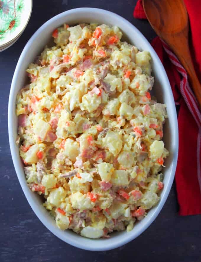 Filipino-style potato salad in a white casserole dish